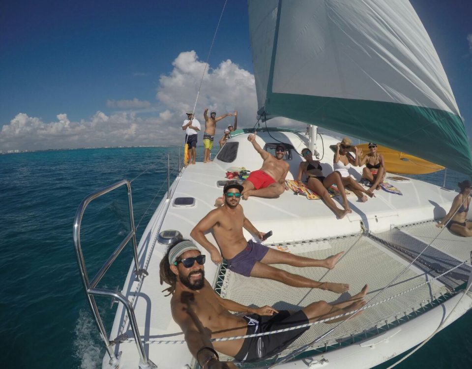vYacth rentals in cancun private catamaran for ren on a private charter in the mexican caribbean puerto morelos puerto aventuras cancun isla mujeres snorkel tour Wild Cat 35 feet